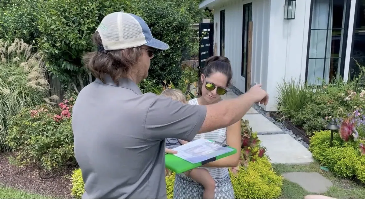 Dave, Treppendahl's landscape designer, walking a homeowner through her landscape plan in Baton Rouge, LA