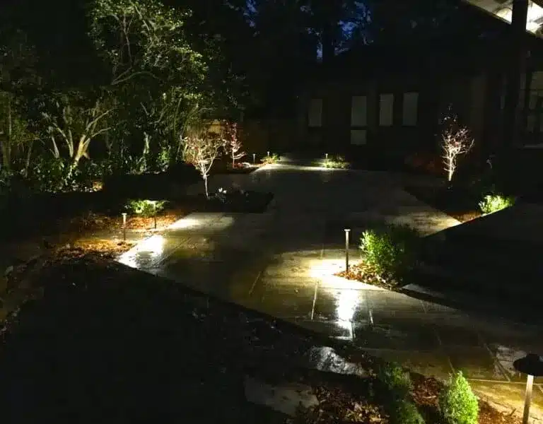 Path lights in beds around a patio in Baton Rouge, LA